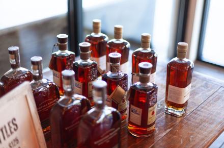 bottles of bourbon in low lighting